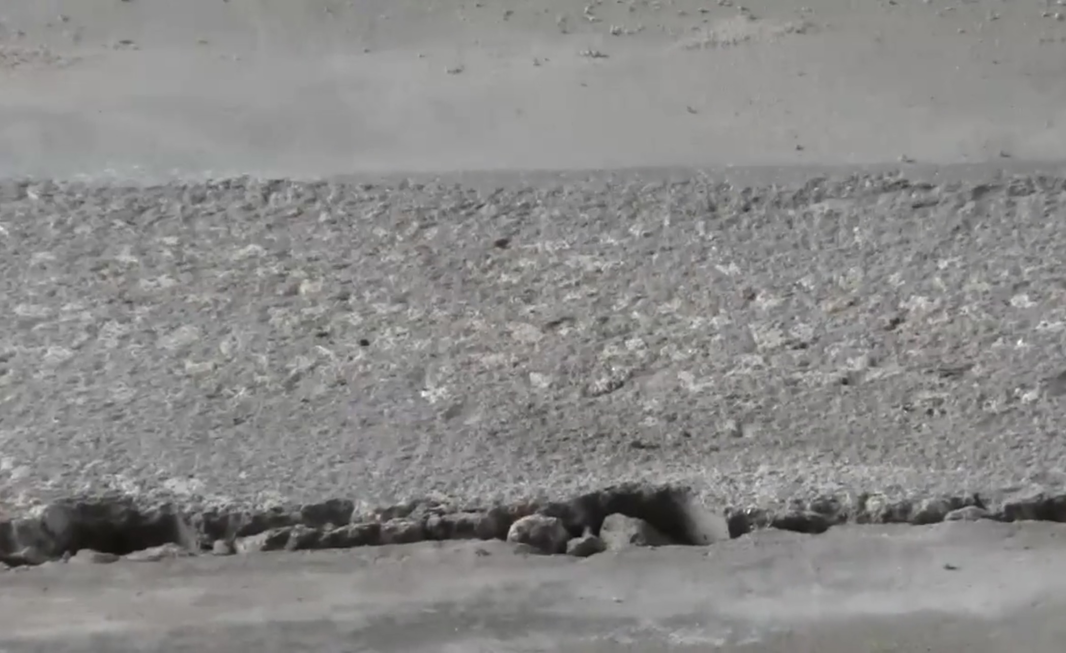 Feathered transition and spall repair on concrete floor in New Zealand